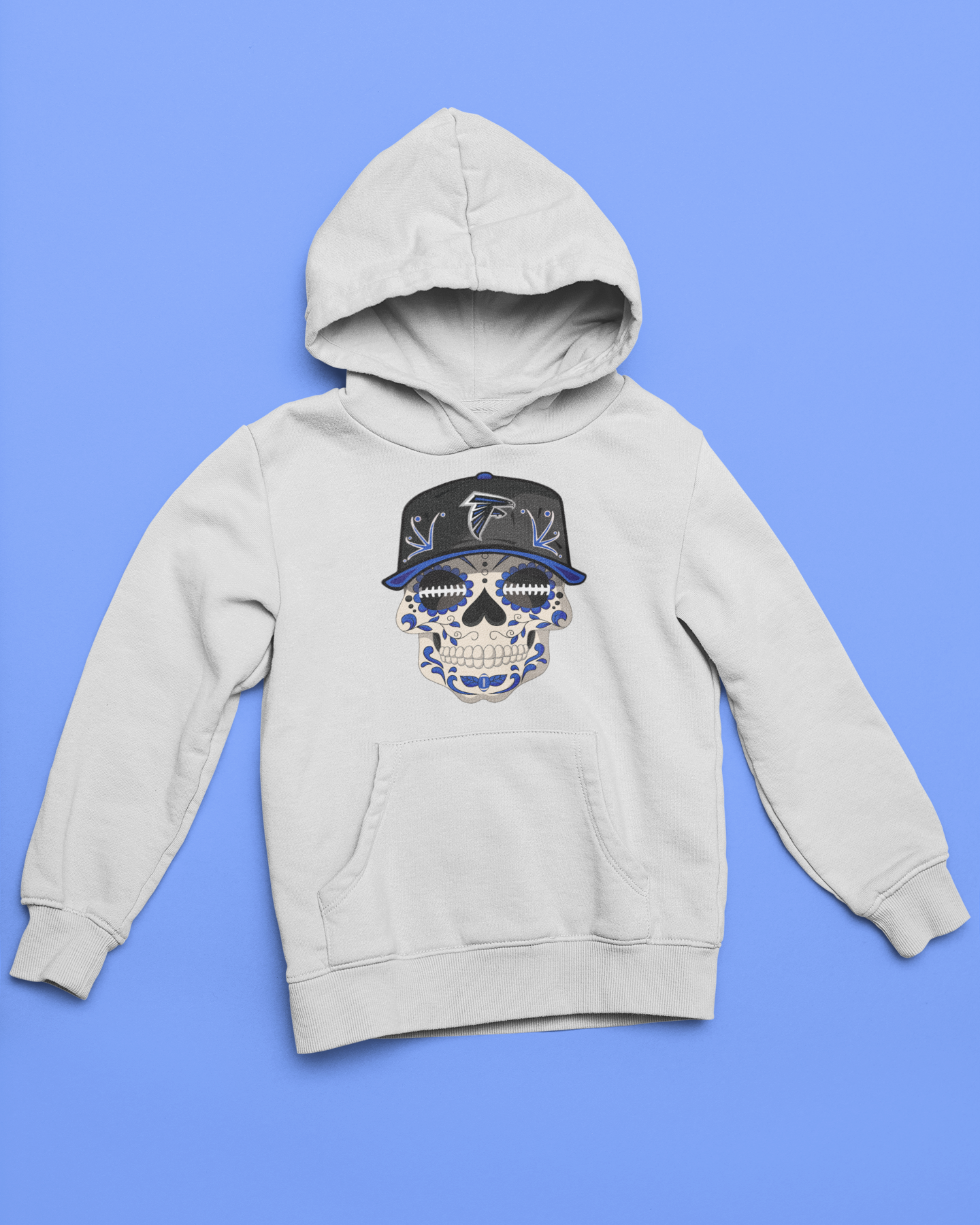 White youth unisex sponge fleece pullover hooded sweatshirt with Sharon Springs Falcons  "Sugar Skull" logo placed against a solid blue surface