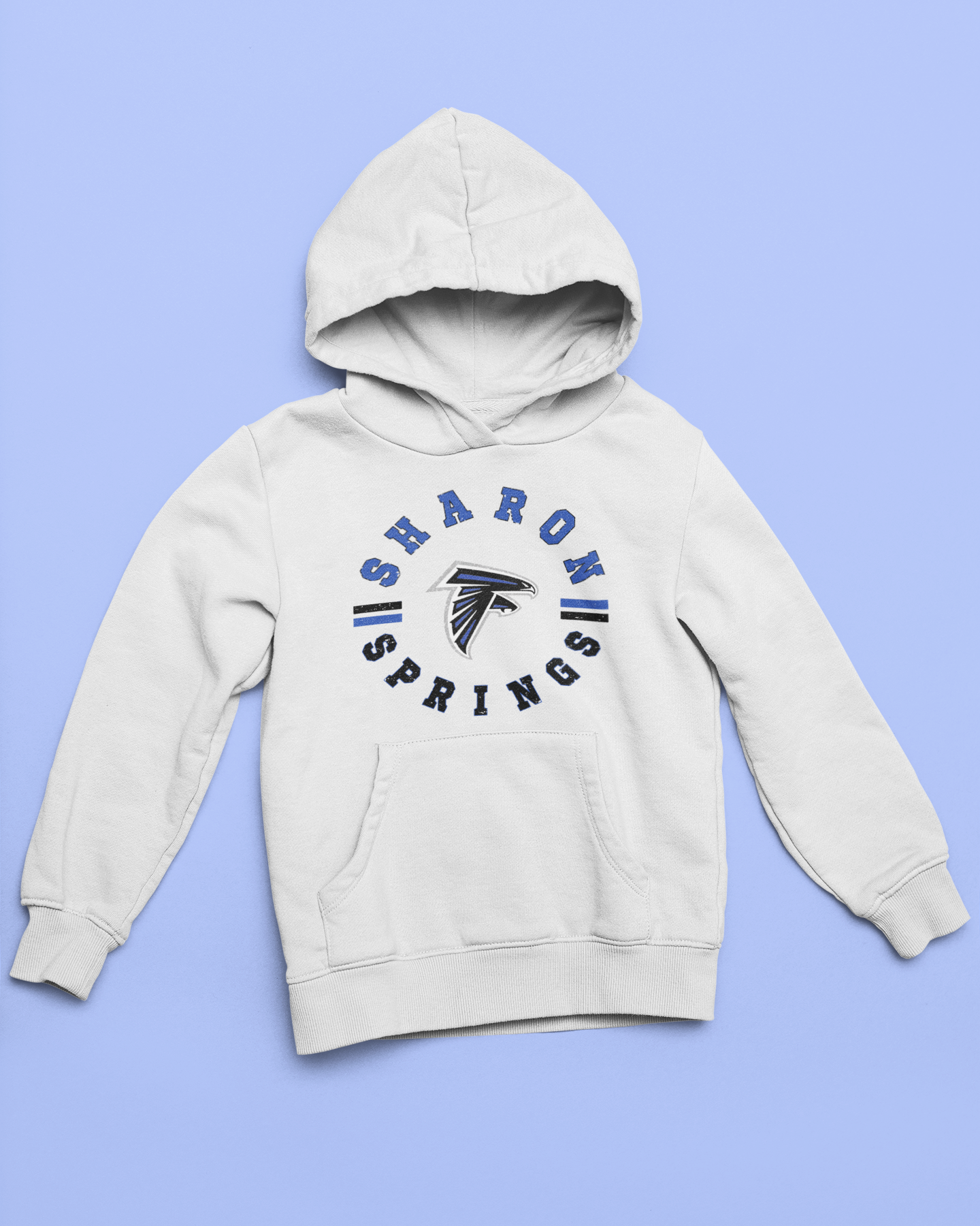 White youth unisex sponge fleece pullover hooded sweatshirt with Sharon Springs Falcons  "Vintage Days" logo placed against a solid blue surface